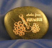 Hawaiian flowers carved on rock