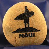 Maui surfer carvedon rock